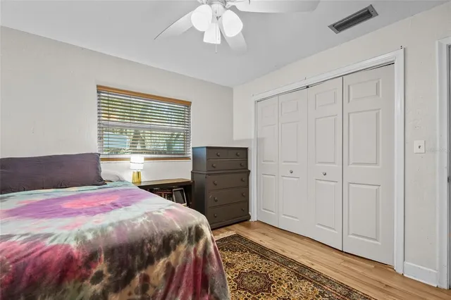 a bedroom with a bed and a dresser