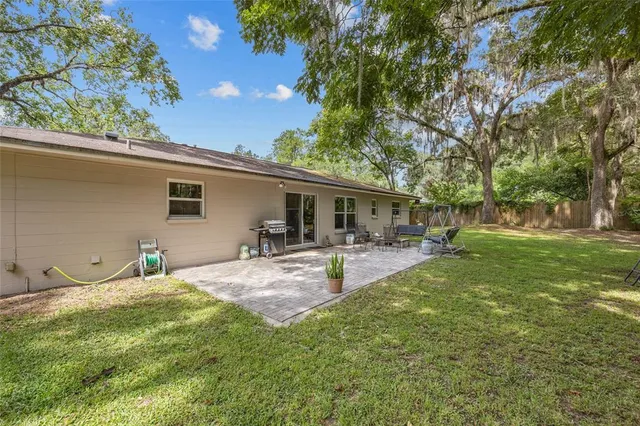 a front view of house with yard patio and green space