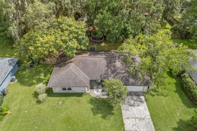 a aerial view of a house with a yard