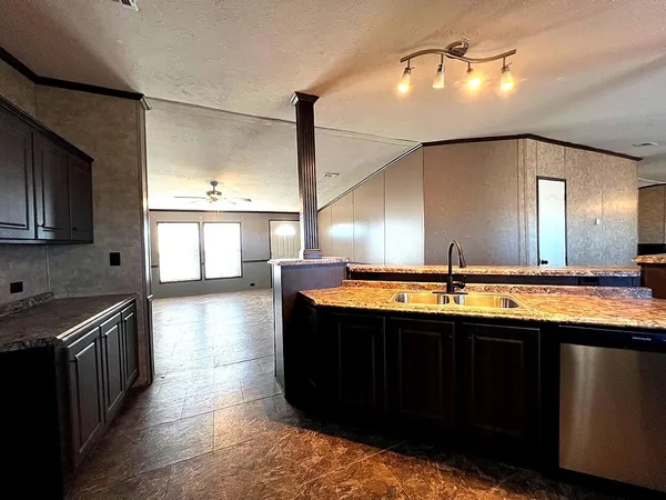 a kitchen with a sink and stove