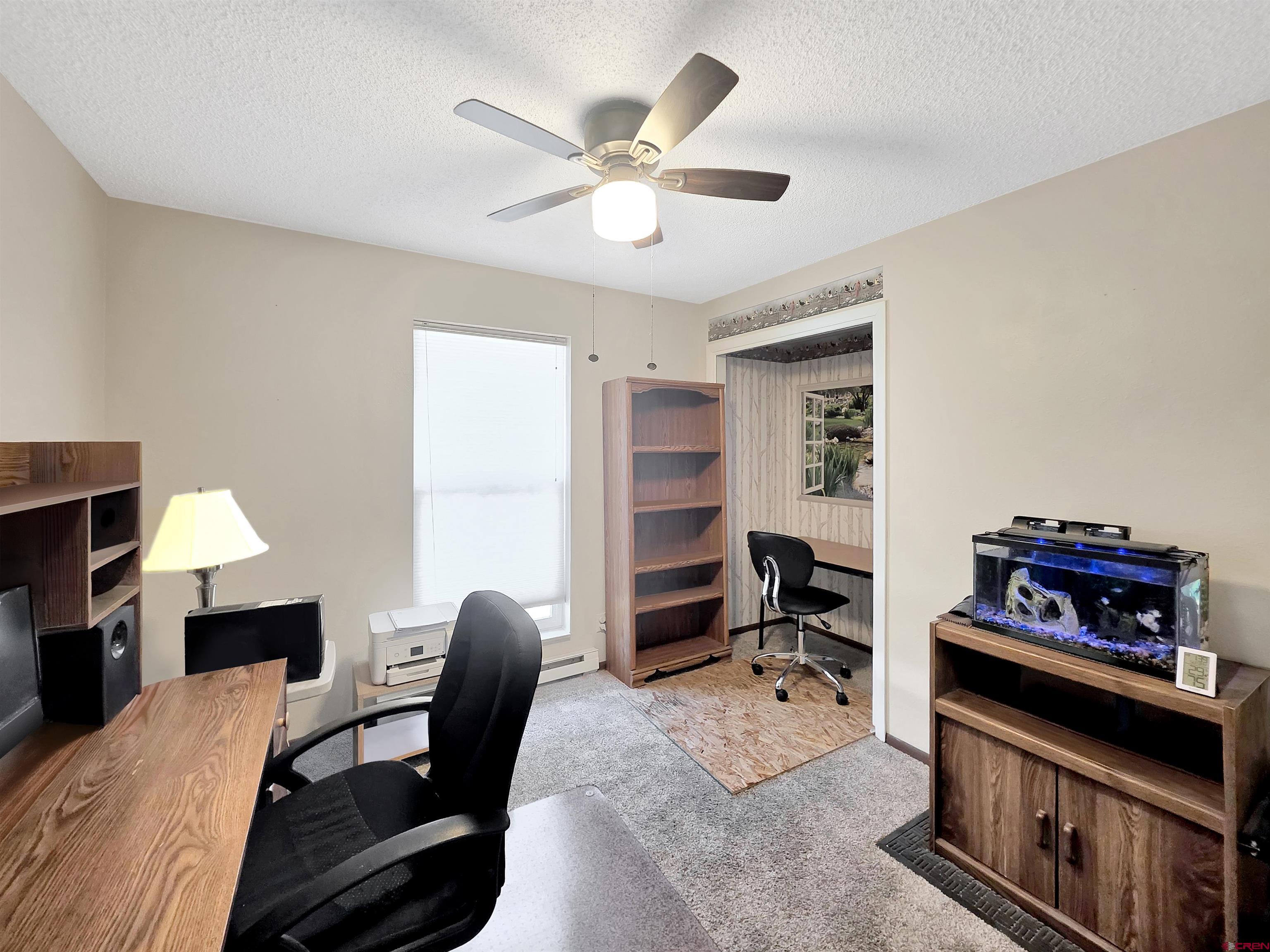 613 Colorado Street Cortez, CO 81321 - Photo 14 of 19 a workspace with furniture