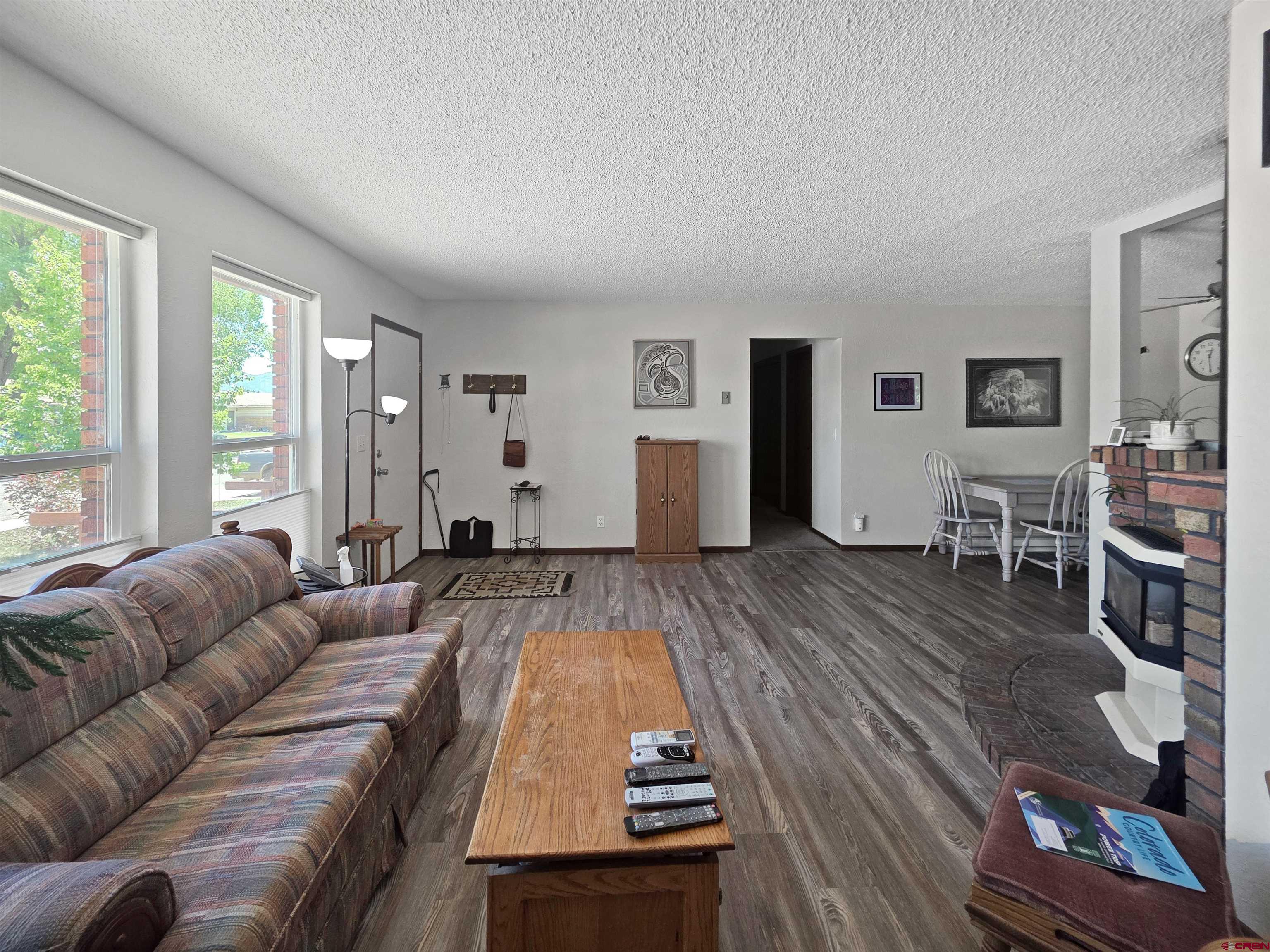 613 Colorado Street Cortez, CO 81321 - Photo 14 of 19 a living room with furniture and a wooden floor