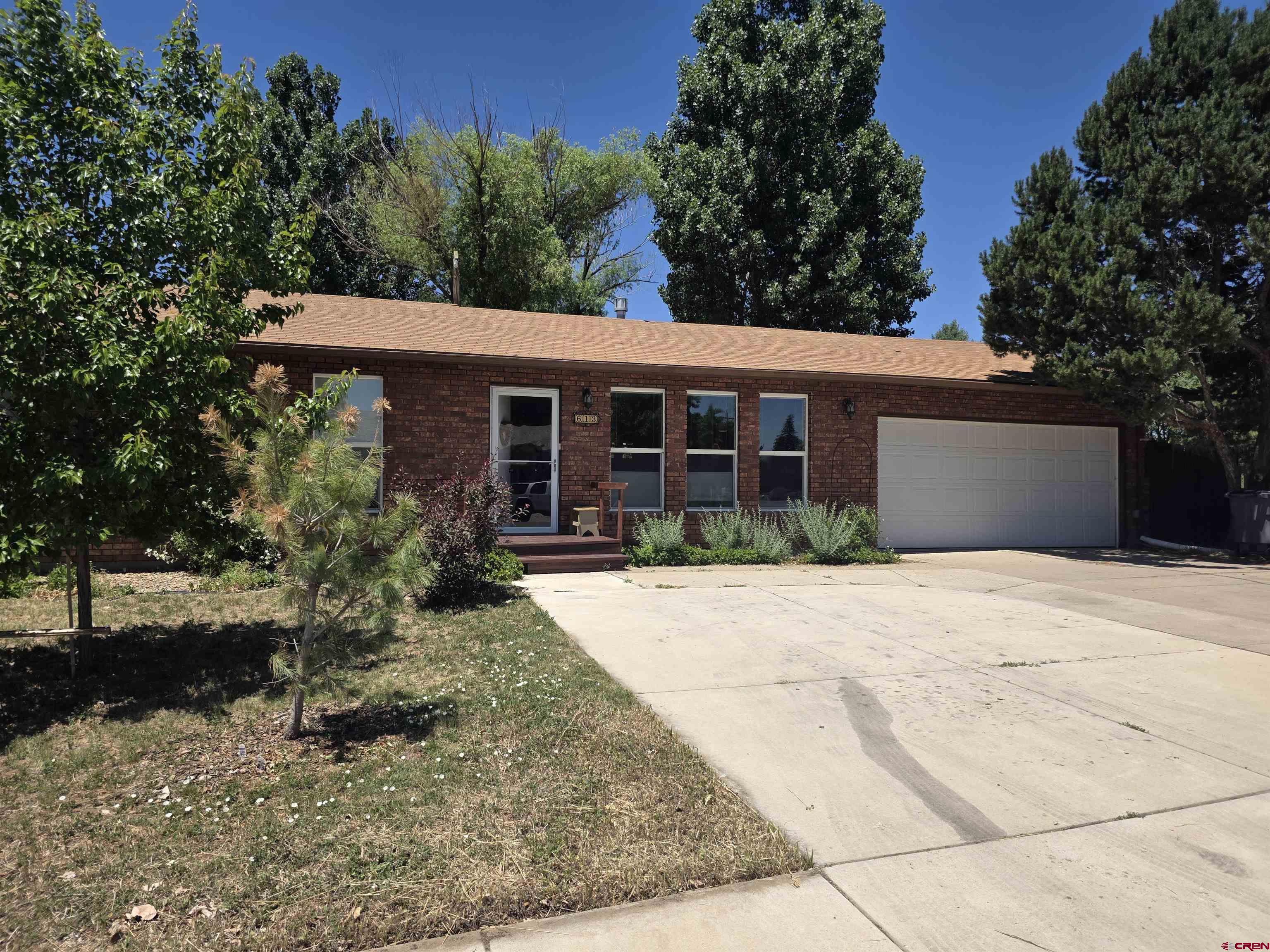 613 Colorado Street Cortez, CO 81321 - Photo 15 of 19 front view of a house with a yard