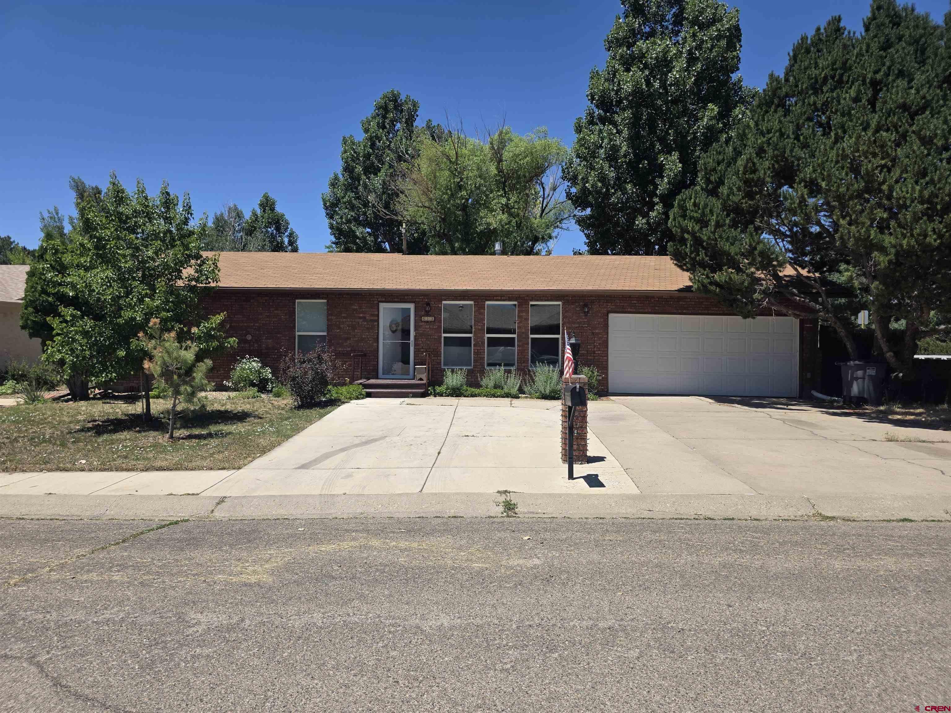 613 Colorado Street Cortez, CO 81321 - Photo 16 of 19 a house with a street