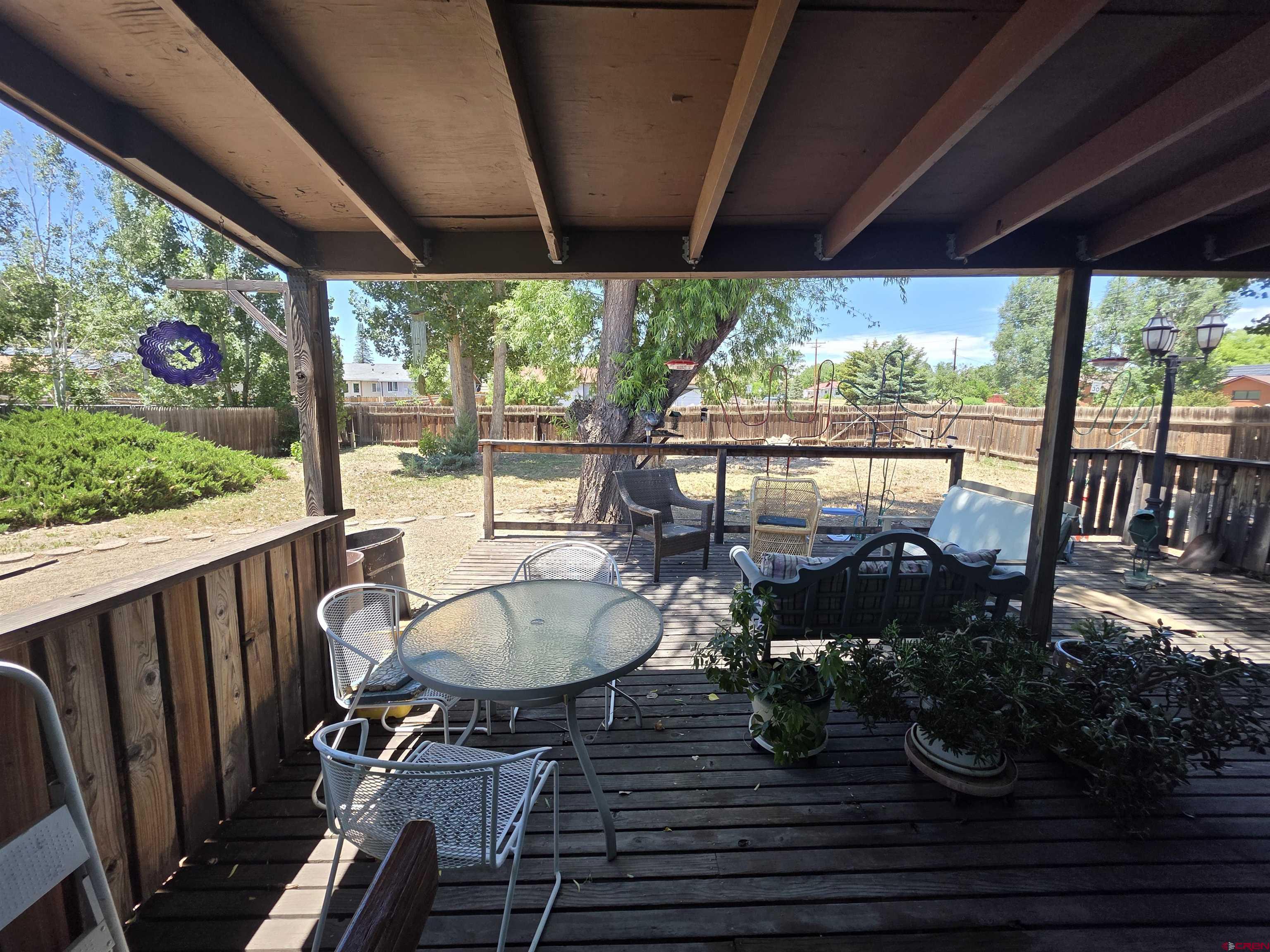 613 Colorado Street Cortez, CO 81321 - Photo 17 of 19 a dining room with furniture wooden floor and garden view