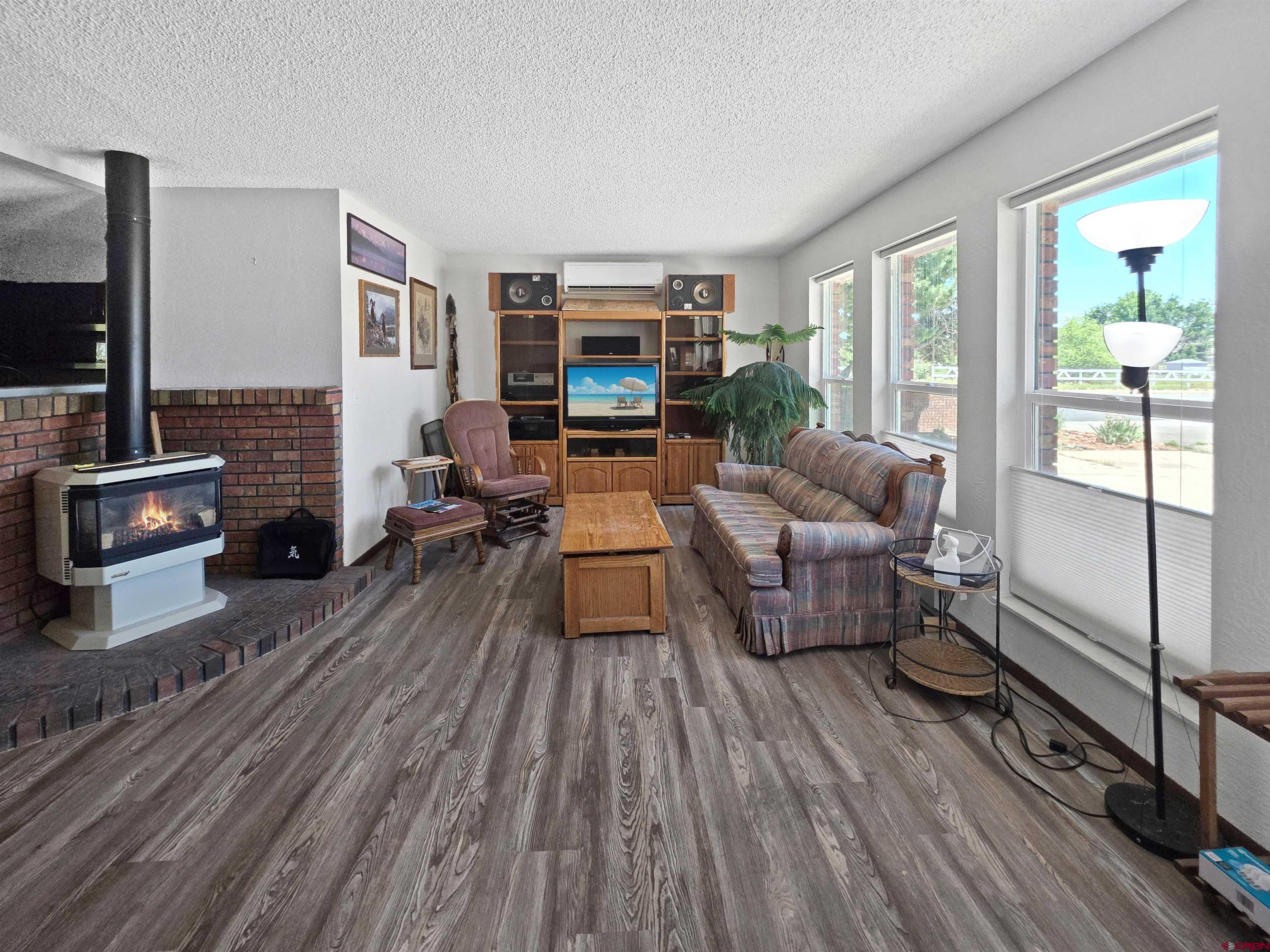 613 Colorado Street Cortez, CO 81321 - Photo 19 of 19 a living room with furniture and a wooden floor