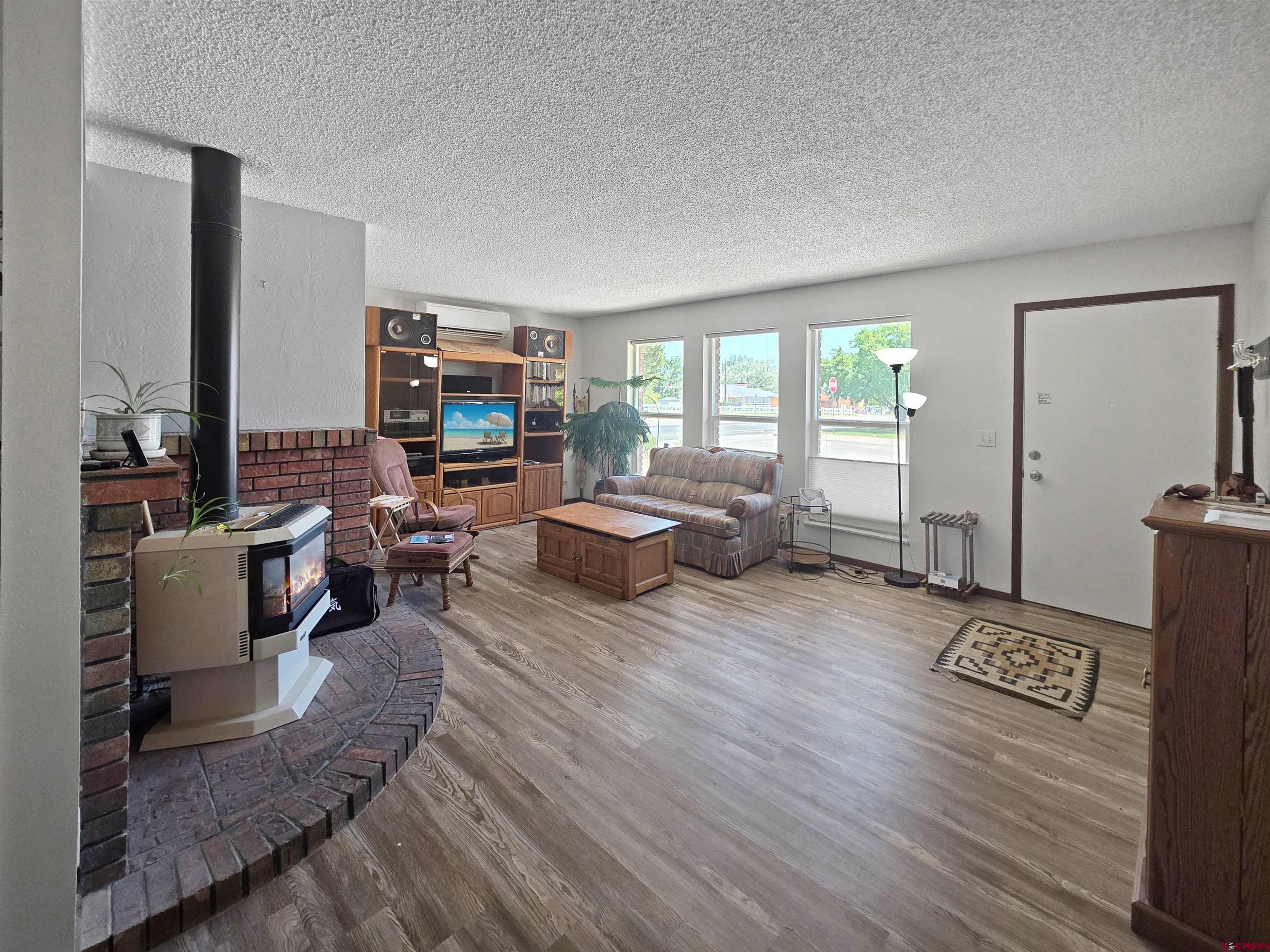 613 Colorado Street Cortez, CO 81321 - Photo 2 of 19 a living room with furniture wooden floor and a large window