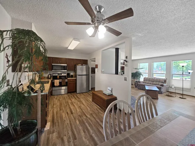 a very nice looking living room with a large window and a fireplace