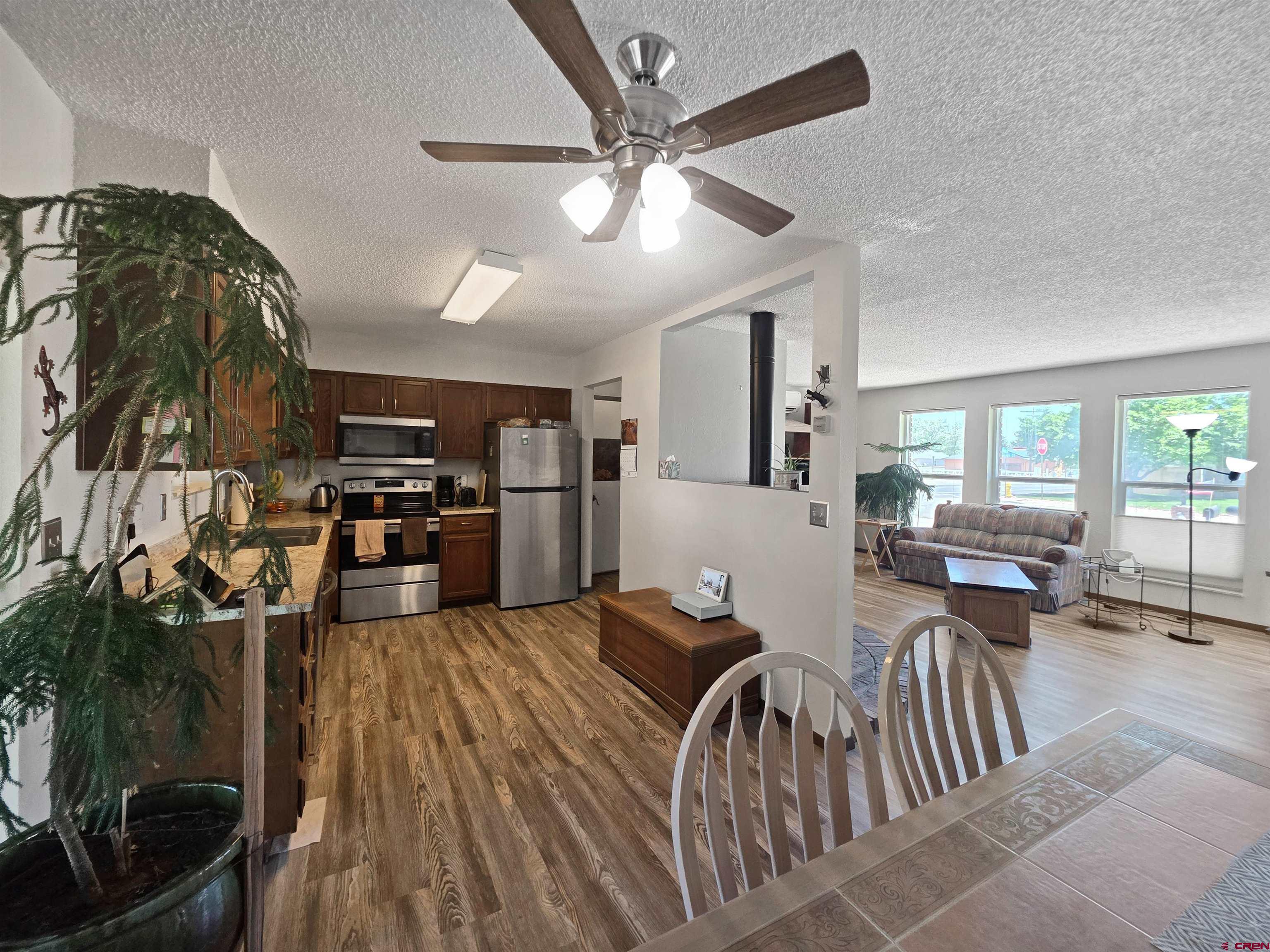 613 Colorado Street Cortez, CO 81321 - Photo 10 of 19 a very nice looking living room with a large window and a fireplace
