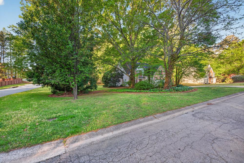 4035 Lakeside Boulevard Monroe, GA 30655 - Photo 11 of 43 a huge green field with lots of trees
