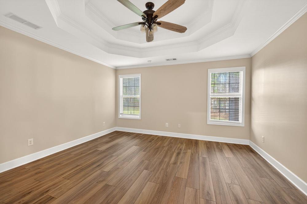 4035 Lakeside Boulevard Monroe, GA 30655 - Photo 22 of 43 wooden floor in an empty room with a window