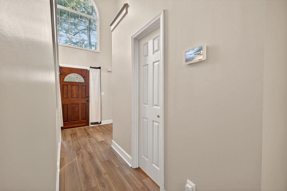 4035 Lakeside Boulevard Monroe, GA 30655 - Photo 24 of 43 a view of a hallway with wooden floor and a cabinet