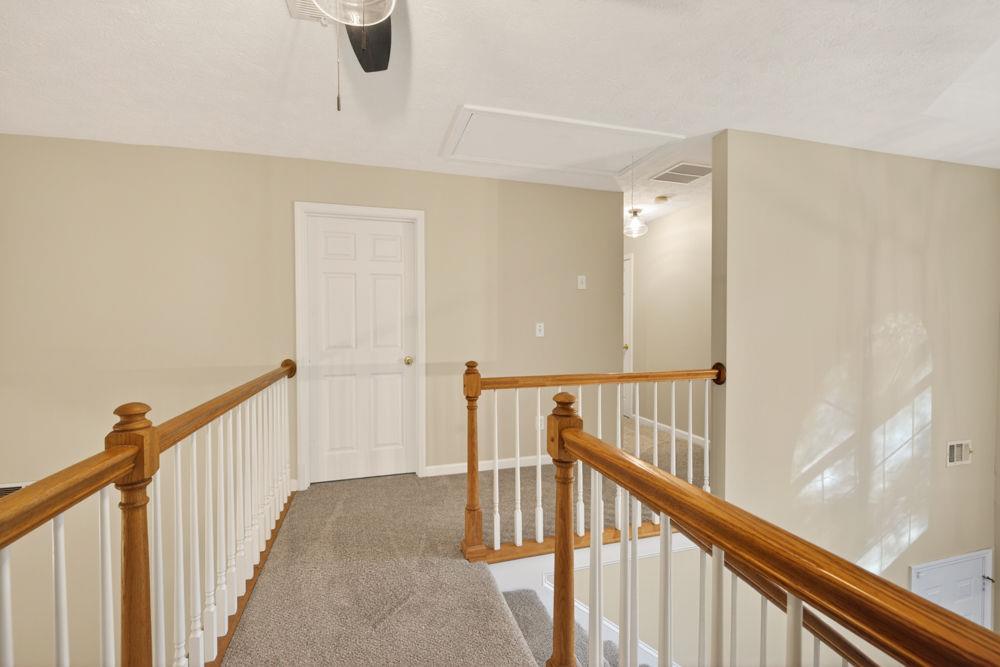 4035 Lakeside Boulevard Monroe, GA 30655 - Photo 27 of 43 a view of a hallway with staircase