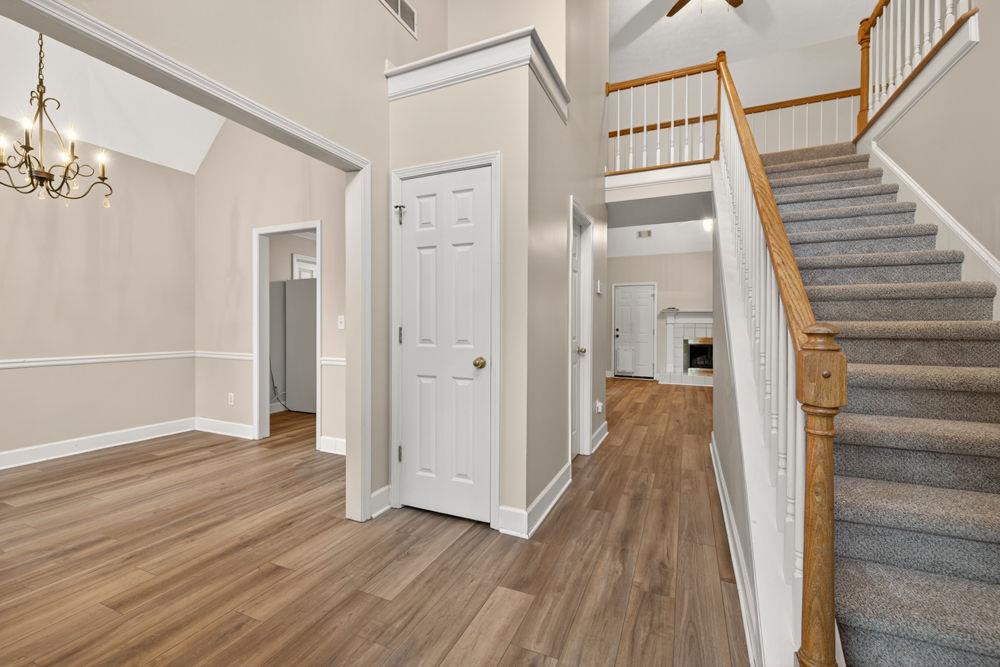 4035 Lakeside Boulevard Monroe, GA 30655 - Photo 3 of 43 a view of a hallway with wooden floor and staircase