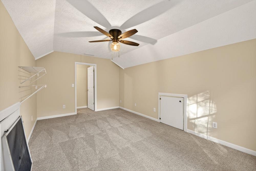 4035 Lakeside Boulevard Monroe, GA 30655 - Photo 31 of 43 a view of a room with a ceiling fan and a window