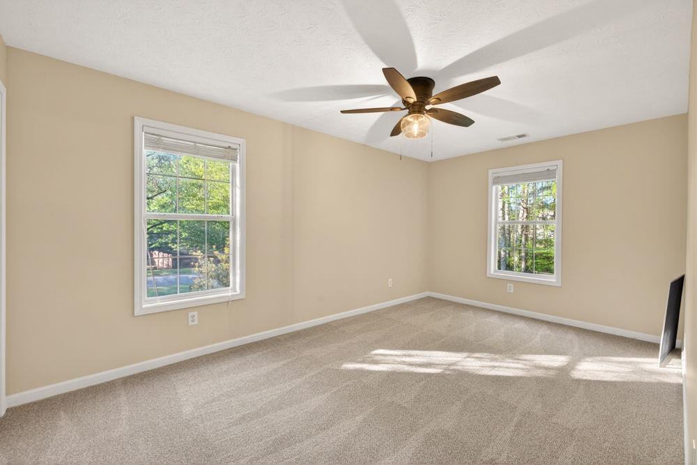 4035 Lakeside Boulevard Monroe, GA 30655 - Photo 34 of 43 a view of a big room with windows and chandelier fan