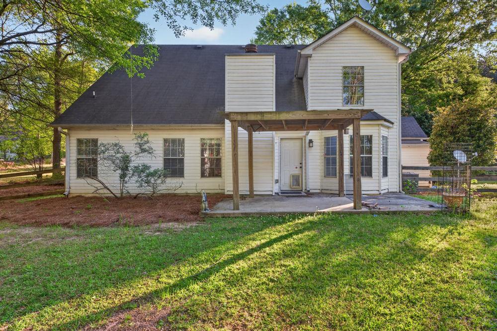 4035 Lakeside Boulevard Monroe, GA 30655 - Photo 37 of 43 front view of a house with a yard