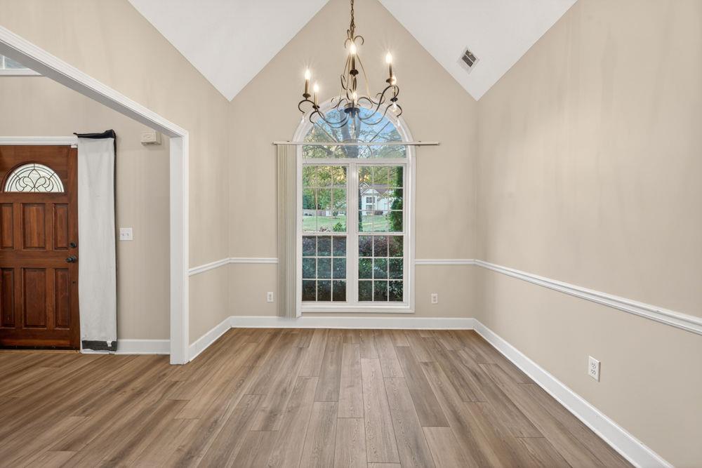 4035 Lakeside Boulevard Monroe, GA 30655 - Photo 4 of 43 wooden floor in an empty room with a window
