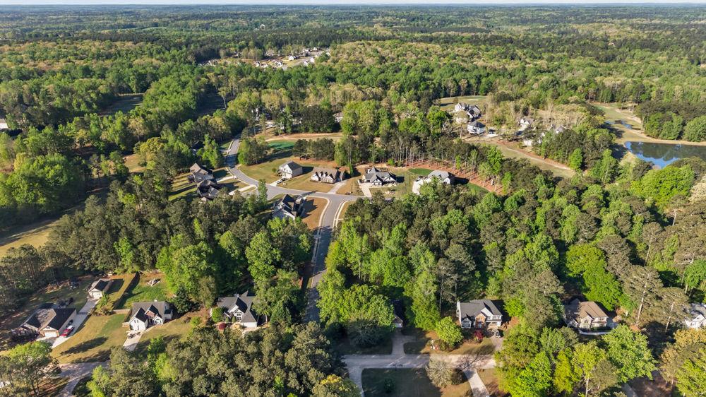 4035 Lakeside Boulevard Monroe, GA 30655 - Photo 42 of 43 an aerial view of residential houses with outdoor space and trees