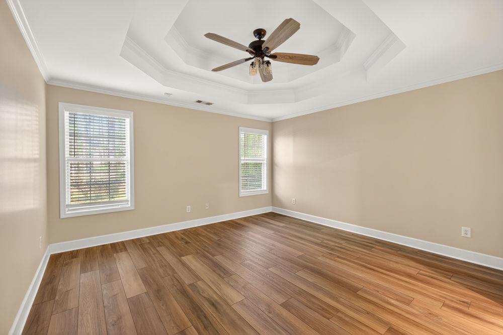 4035 Lakeside Boulevard Monroe, GA 30655 - Photo 8 of 43 wooden floor in an empty room with a window