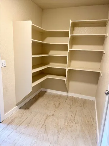 a view of an empty room with empty racks