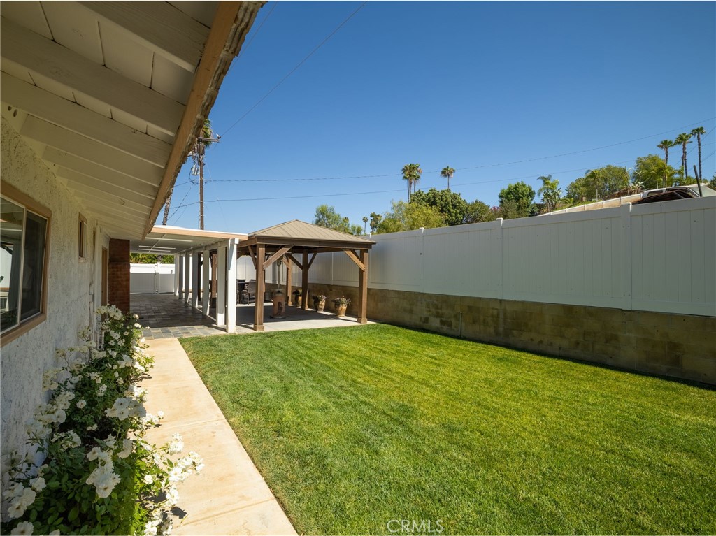 15510 Surrey Court Riverside, CA 92506 - Photo 43 of 61 Fully vinyl fenced back area off the kitchen and living area of main house.