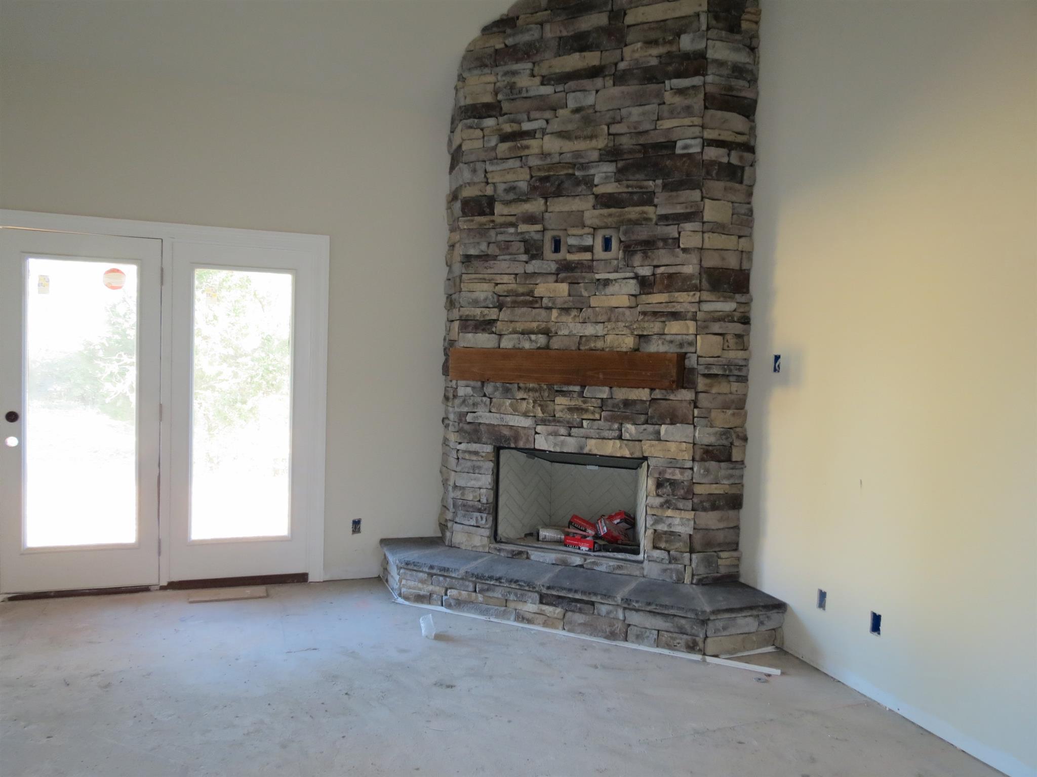 55 Harbor Pointe Lebanon, TN 37087 - Photo 12 of 29 a living room with a fireplace and a window