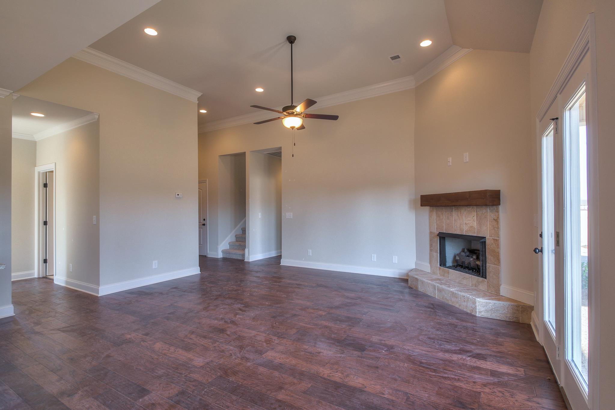 55 Harbor Pointe Lebanon, TN 37087 - Photo 20 of 29 an empty room with fan and a fireplace