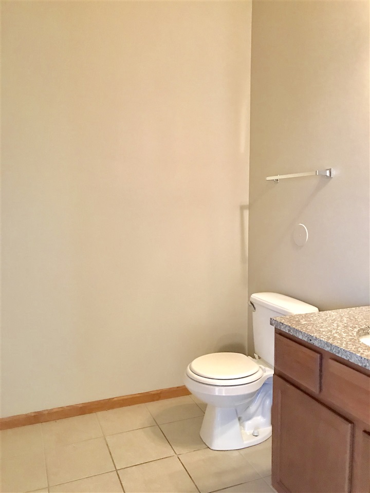 15634 Stonecrest Road South Beloit, IL 61080 - Photo 13 of 15 a white toilet sitting next to a bathroom sink