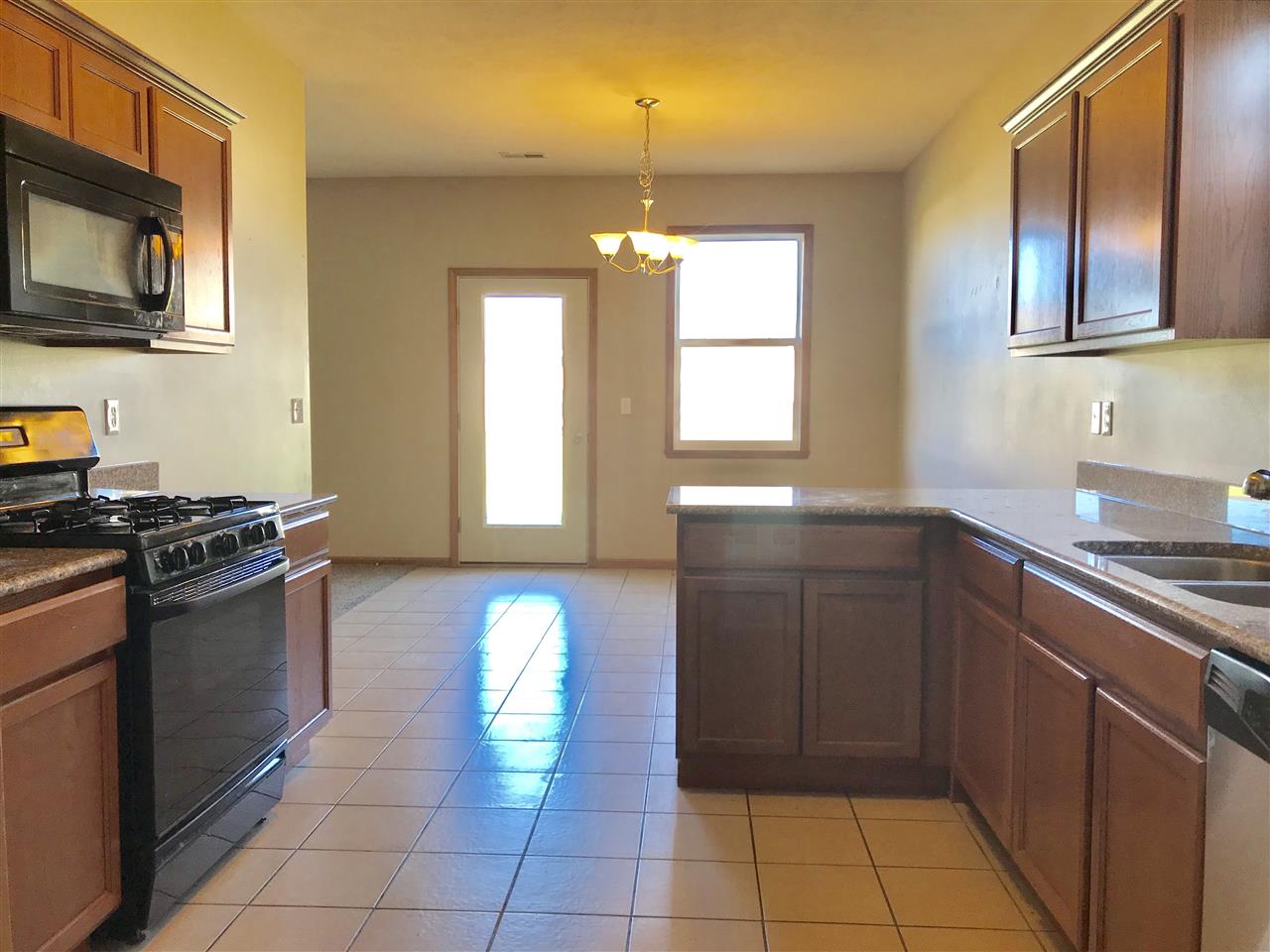 15634 Stonecrest Road South Beloit, IL 61080 - Photo 7 of 15 a kitchen with a sink stove and microwave
