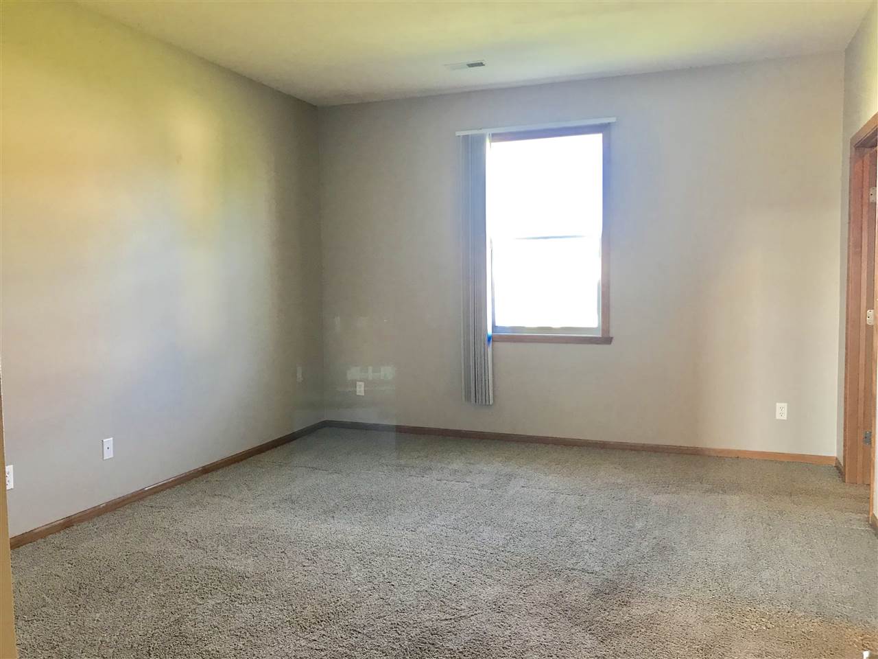 15634 Stonecrest Road South Beloit, IL 61080 - Photo 8 of 15 an empty room with a window