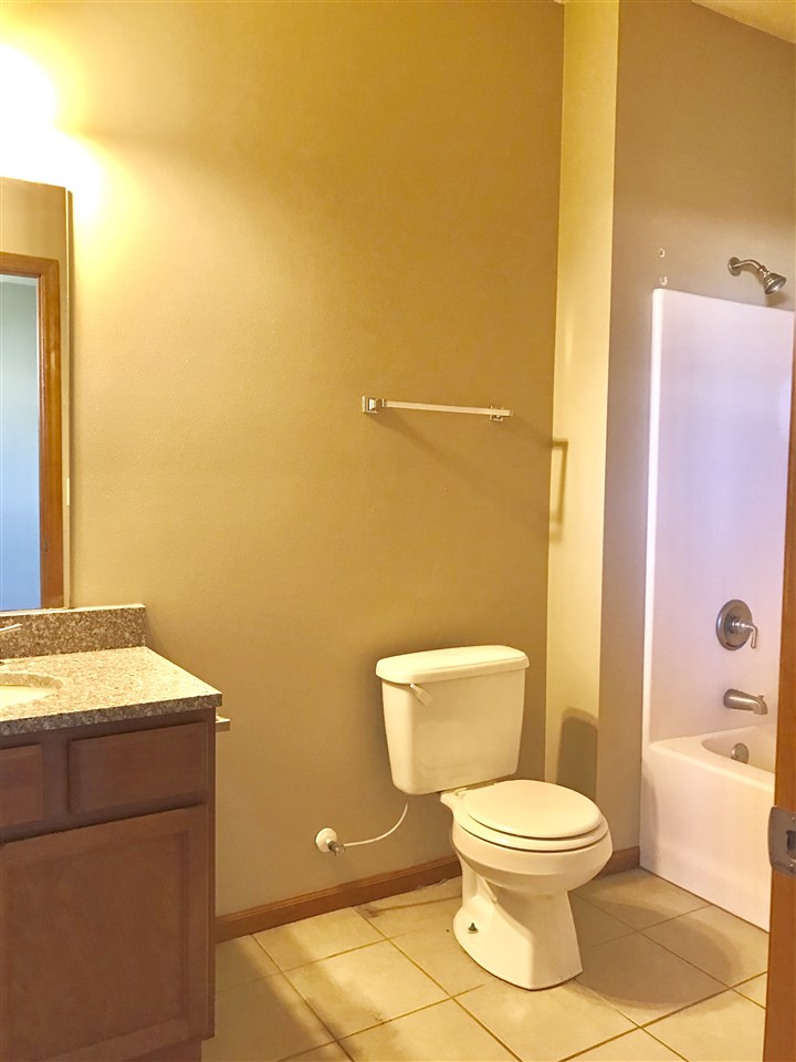 15634 Stonecrest Road South Beloit, IL 61080 - Photo 9 of 15 a white toilet sitting next to a bathroom sink