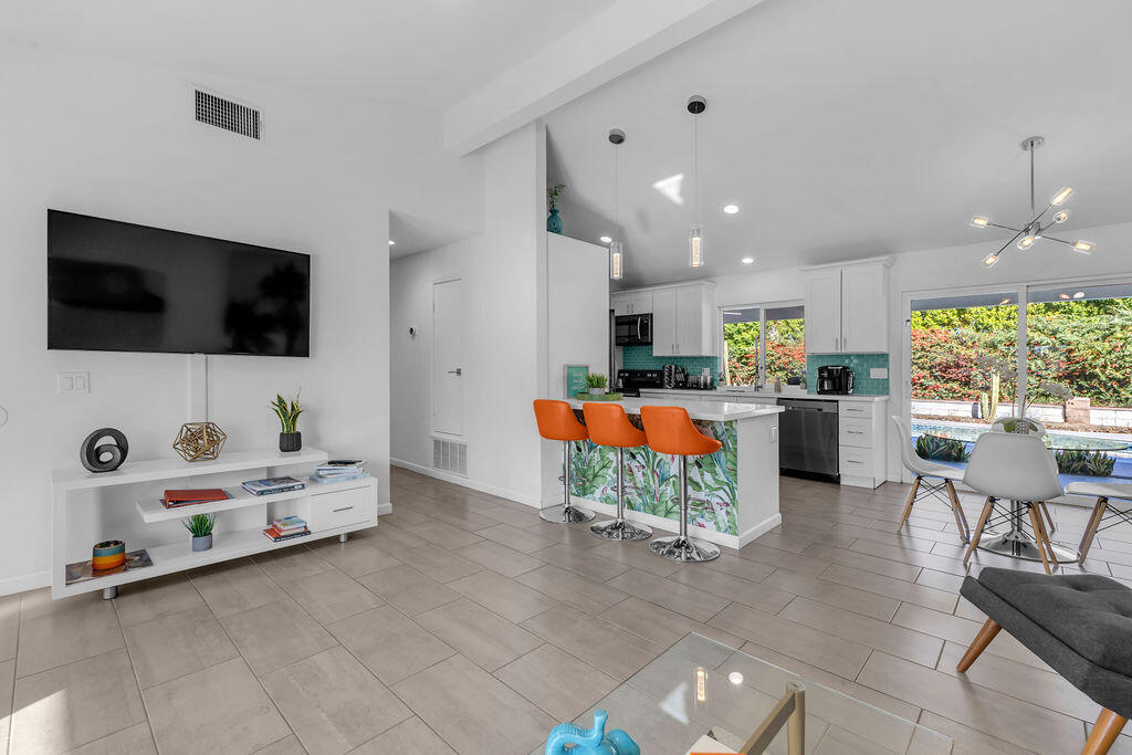 2304 East Bellamy Road Palm Springs, CA 92262 - Photo 10 of 32 a living room with furniture and a flat screen tv