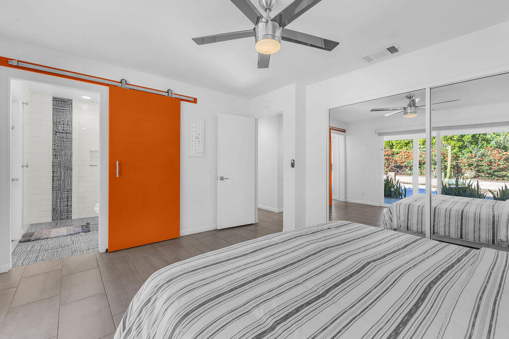 2304 East Bellamy Road Palm Springs, CA 92262 - Photo 19 of 32 a bedroom with a bed and a large window