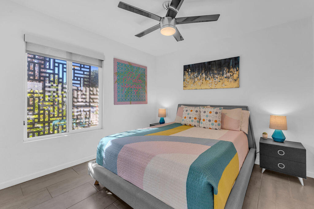 2304 East Bellamy Road Palm Springs, CA 92262 - Photo 21 of 32 a bedroom with a bed and a window