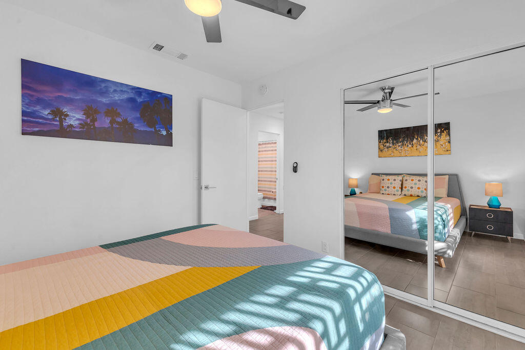 2304 East Bellamy Road Palm Springs, CA 92262 - Photo 22 of 32 a bedroom with a bed and a couch