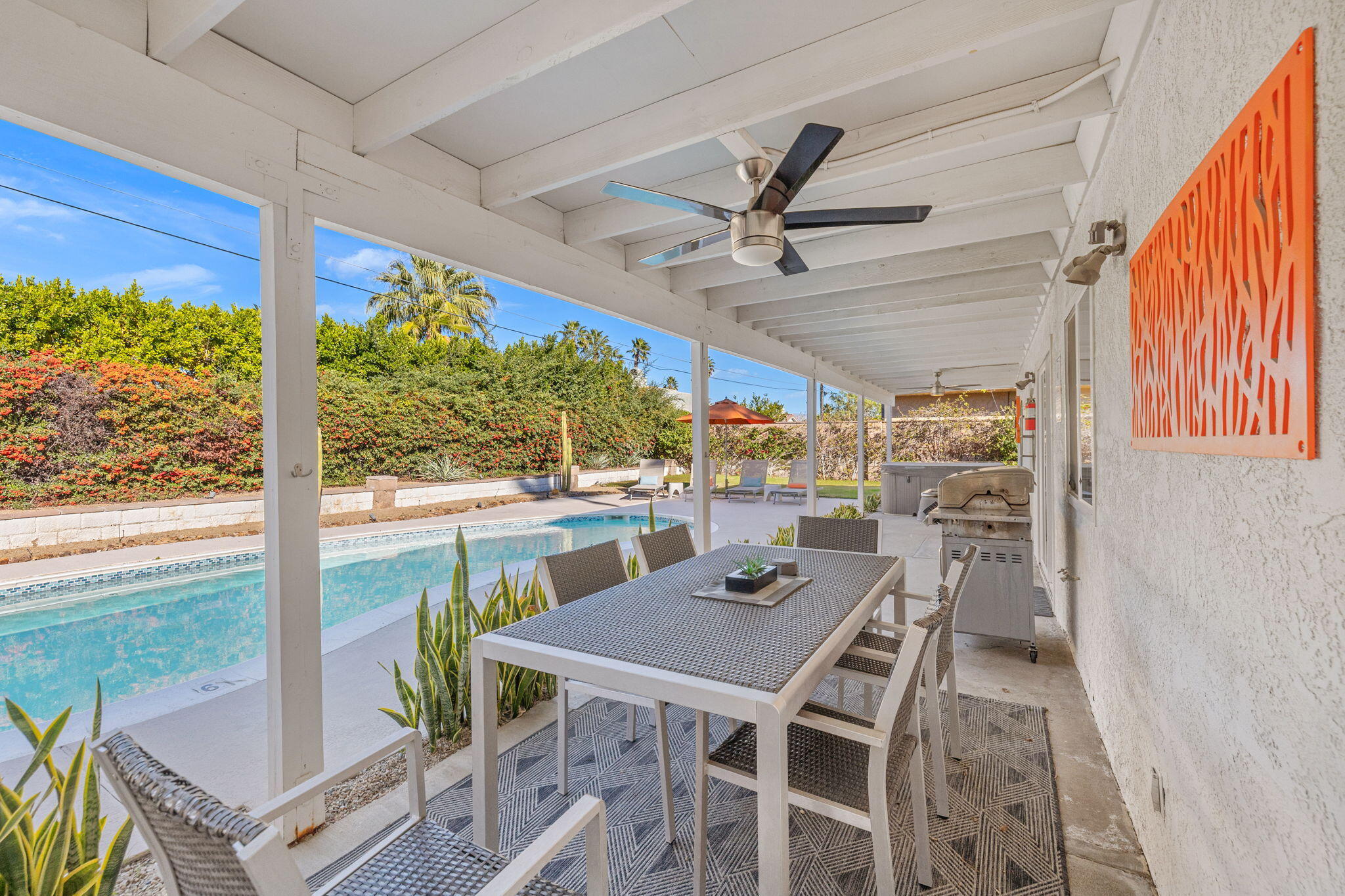 2304 East Bellamy Road Palm Springs, CA 92262 - Photo 6 of 32 a view of a patio with a table chairs and a table