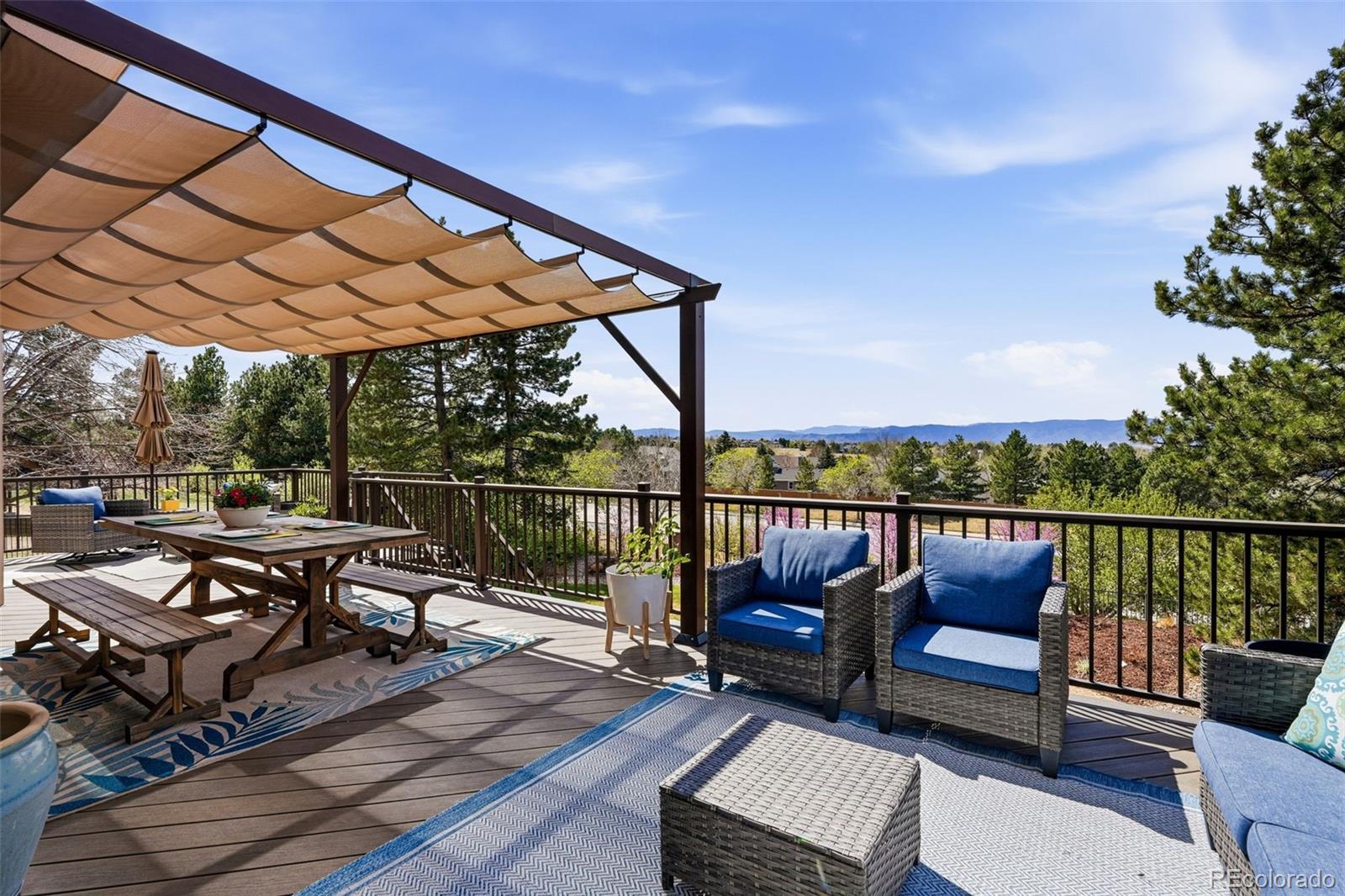 77 Falcon Hills Drive Highlands Ranch, CO 80126 - Photo 28 of 43 a view of a roof deck with couches and wooden floor