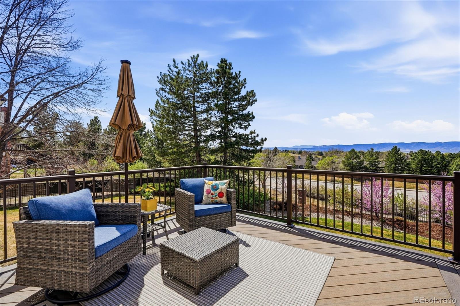 77 Falcon Hills Drive Highlands Ranch, CO 80126 - Photo 34 of 43 a view of roof deck with couches and wooden floor