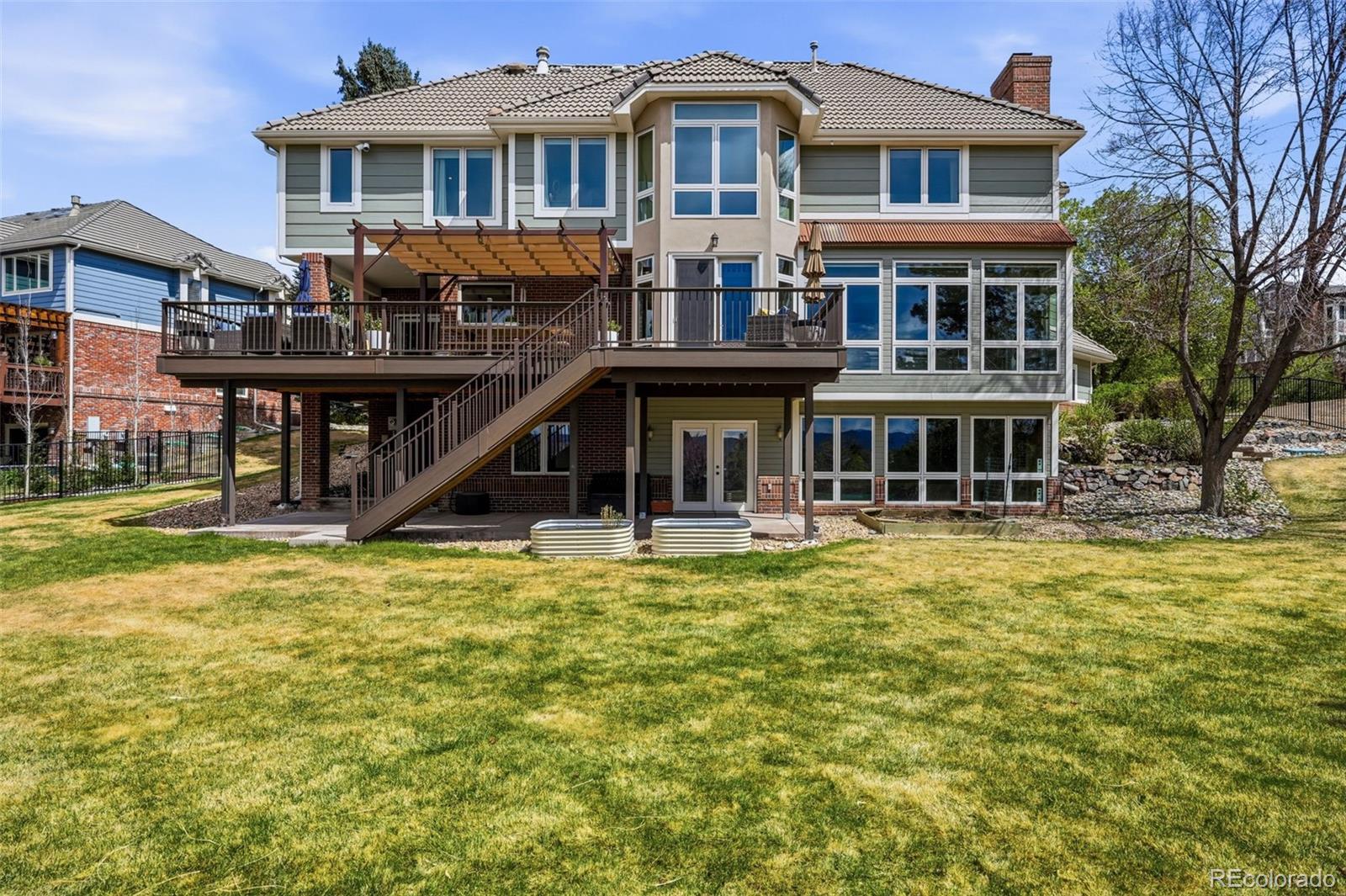 77 Falcon Hills Drive Highlands Ranch, CO 80126 - Photo 37 of 43 a front view of a house with swimming pool