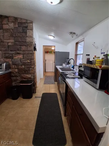 a bedroom with a bed and lamp