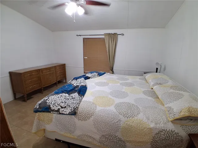 a bathroom with a toilet a sink and shower