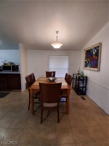 a bedroom with a bed and a mirror