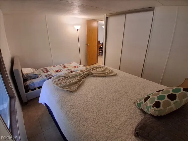 a backyard of a house with wooden floor and fence