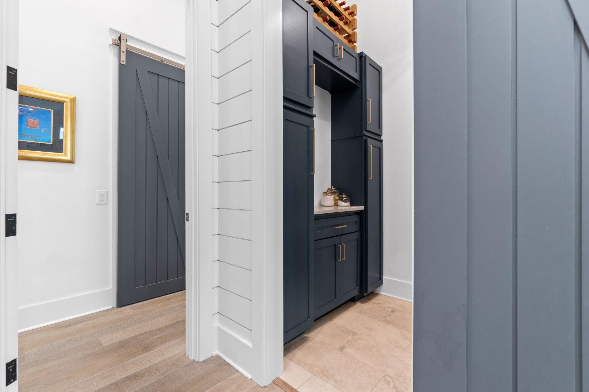 92 Rosecourt Street Inlet Beach, FL 32461 - Photo 20 of 65 a view of kitchen cabinets and refrigerator