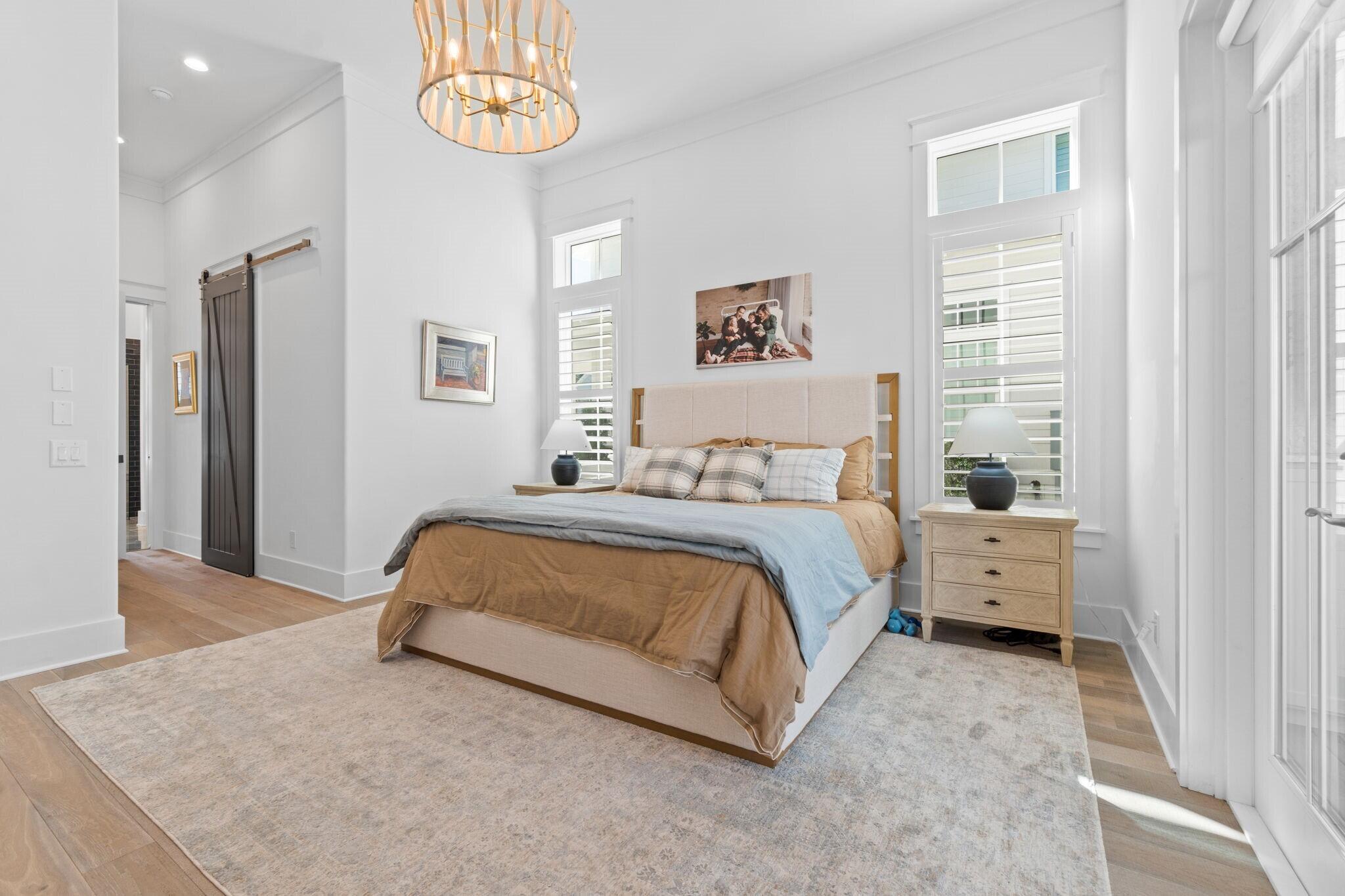 92 Rosecourt Street Inlet Beach, FL 32461 - Photo 23 of 65 a spacious bedroom with a bed and a window