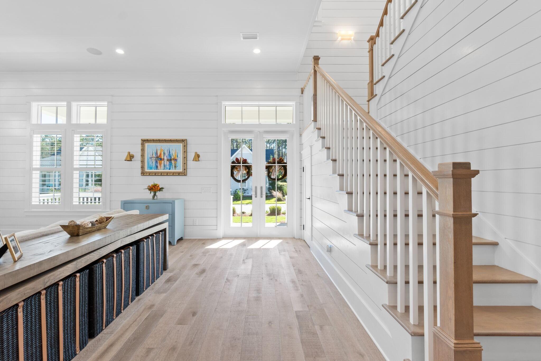 92 Rosecourt Street Inlet Beach, FL 32461 - Photo 27 of 65 a view of a hallway with wooden floor and staircase