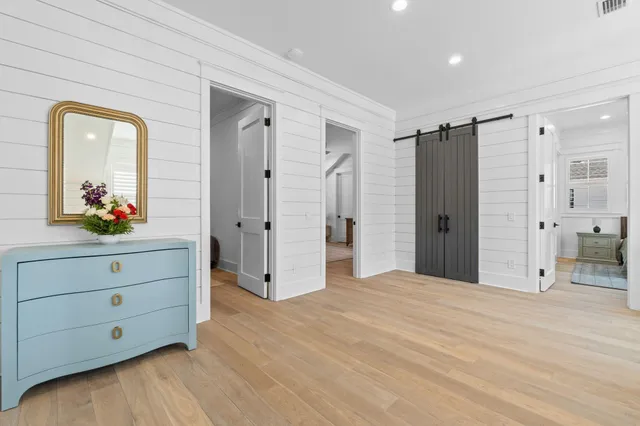 a bedroom with a bed and a table