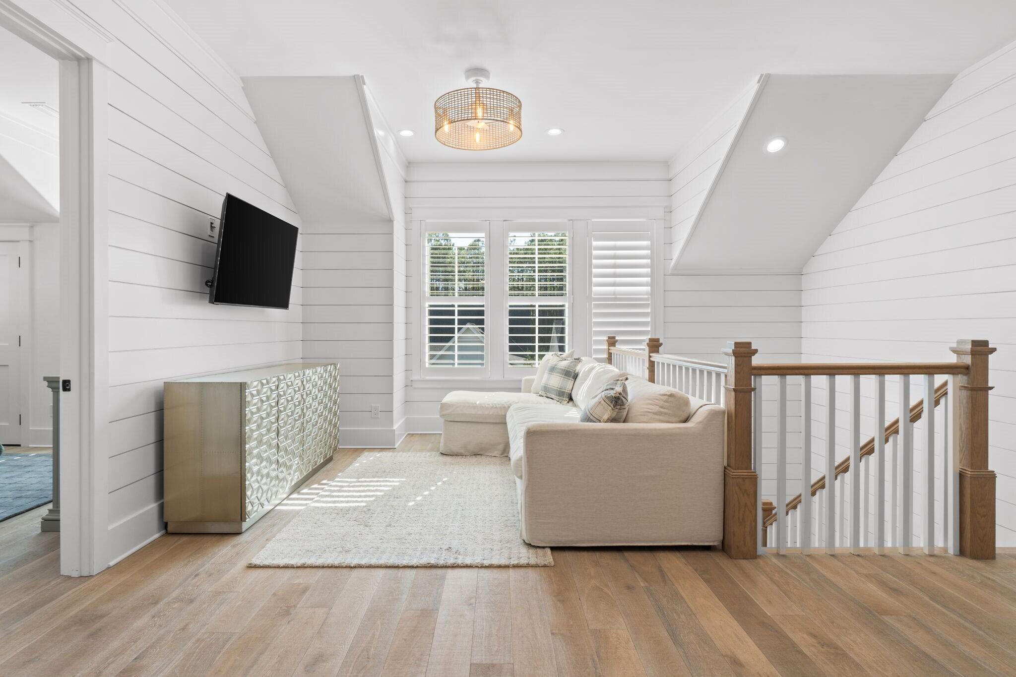 92 Rosecourt Street Inlet Beach, FL 32461 - Photo 29 of 65 a living room with furniture and a flat screen tv