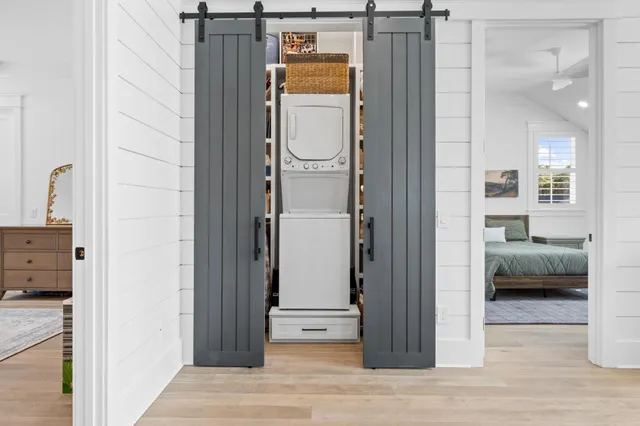 a bathroom with a toilet sink vanity and mirror